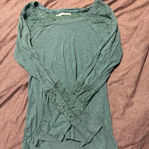 Long sleeve shirt with lace cut outs.